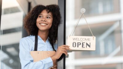 woman opening a coffee shop